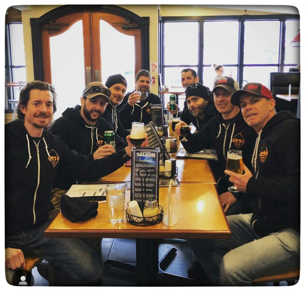 The team enjoys some celebratory beers and coffee